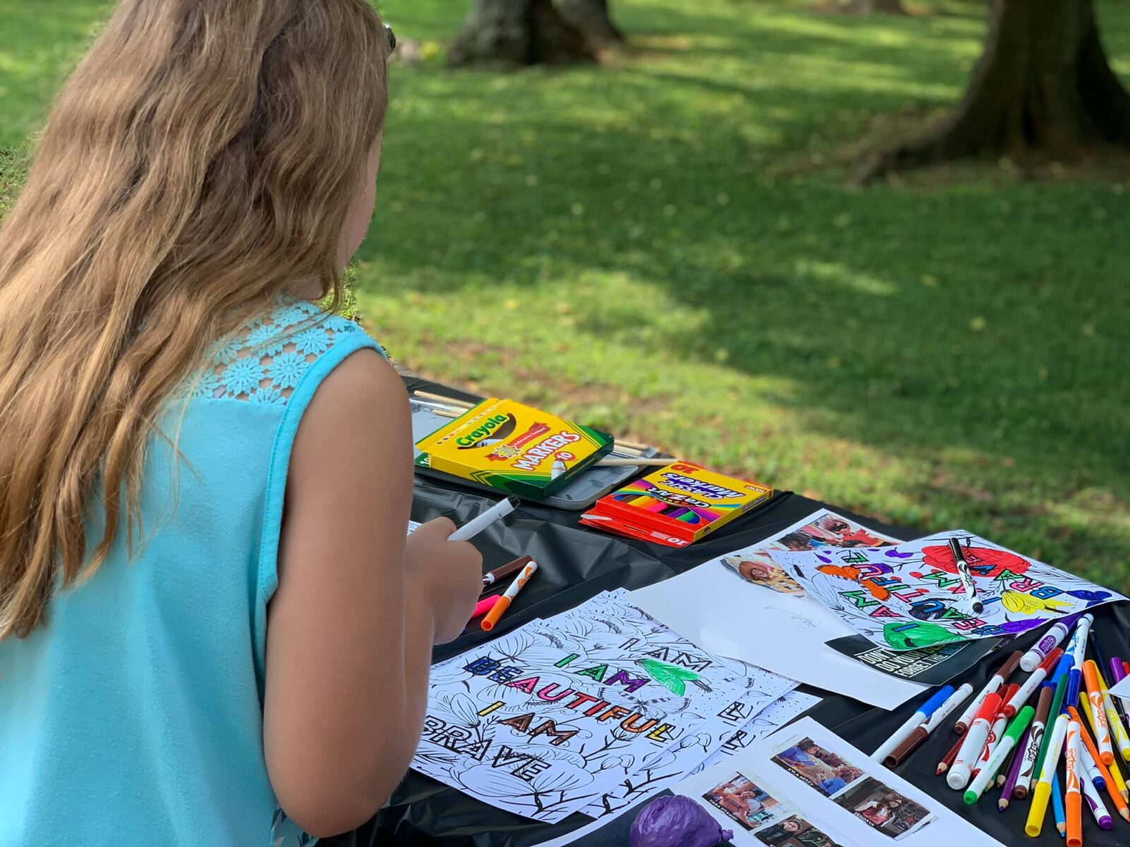 Girl coloring with markers