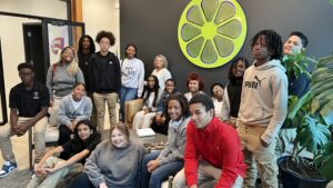 Group photos of MySiS and Jonesville Academy scholars in the lobby of Sublime Media Group